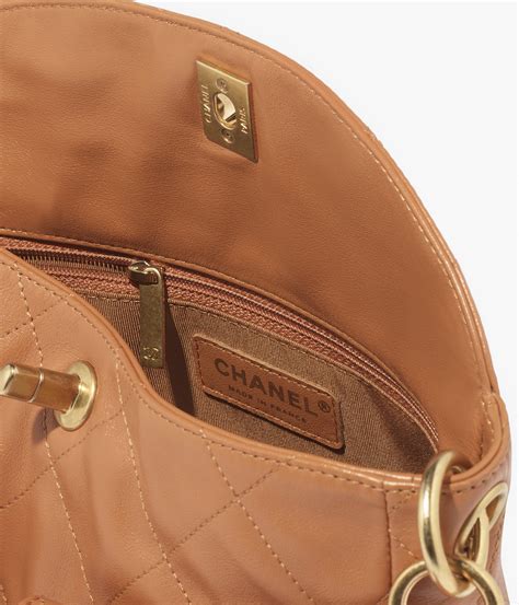 Camel calfskin handbag .